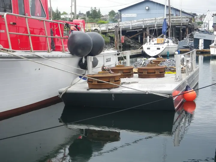 Heavy equipment and chain staged on the barge deck