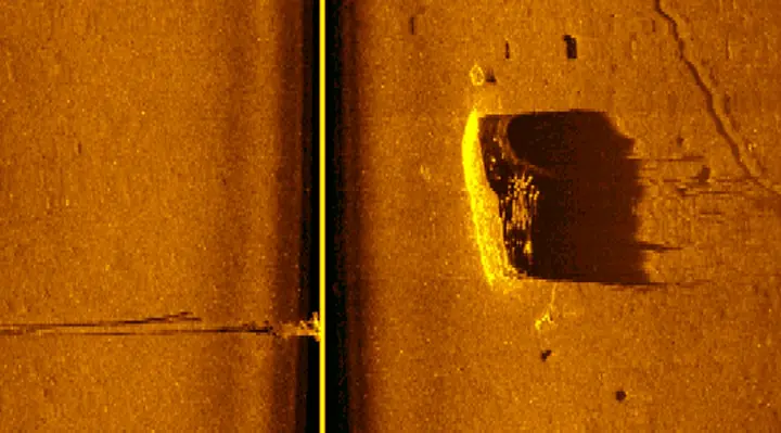 Side-scan sonar image showing a distinct target on the bottom