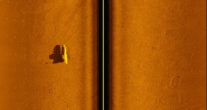 Wide side-scan sonar image showing a target on the bottom
