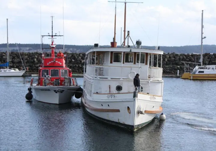CASCADE alongside the vessel LOTUS in harbor