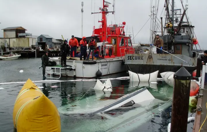 CASCADE and support vessels alongside a salvage barge