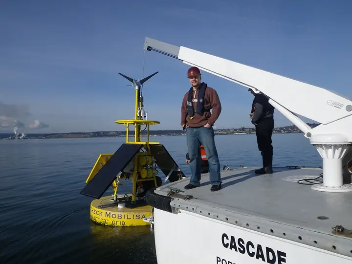 CASCADE crew deploying a marine monitoring buoy