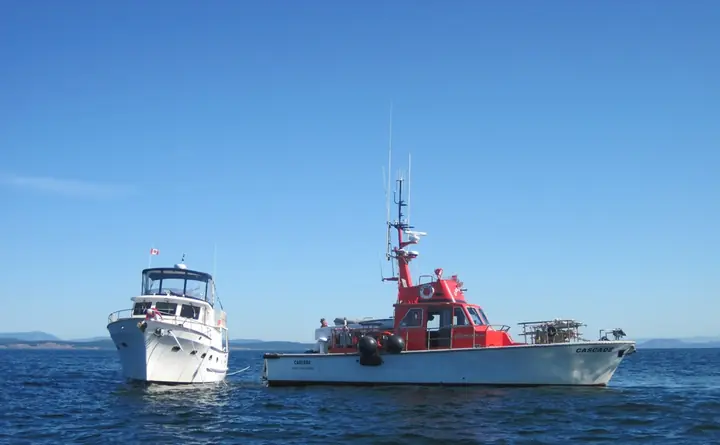 CASCADE alongside another vessel on open water